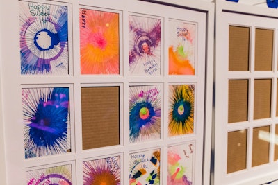 The teenage guests designed and signed their own spin-art pieces, which were framed to create a personalized custom work of art for the birthday girl at the Pop Art party produced by Magnolia Bluebird.