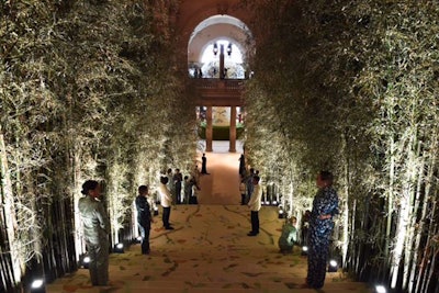 A forest of 6,000 bamboo stems shipped in from Hawaii and Puerto Rico, and ranging between 14 and 25 feet tall, flanked the Great Hall staircase leading up to dinner. It took design director Raul Avila's team one entire day to properly position each stem alongside the custom-laid sisal, the bird, floral, and cherry blossom motif of which was painted by hand. Greeters positioned on the staircase were dressed in custom Michael Kors-designed 'Mandarin Evening' silk pajama shirt and pant ensembles, which the designer has reissued for a limited time for $1,190 on his website. Vogue creative director Grace Coddington, who missed the dinner this year due to a flight to France and stayed only for cocktails, walked the red carpet in the pajama set—which she wore straight to the airport.