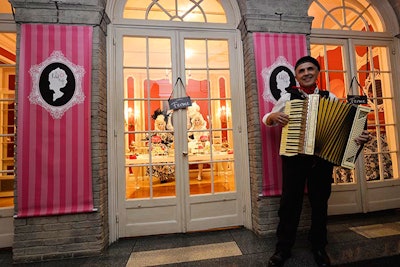 A French accordion player dressed in Parisian style entertained guests as they entered Le Petit Café.