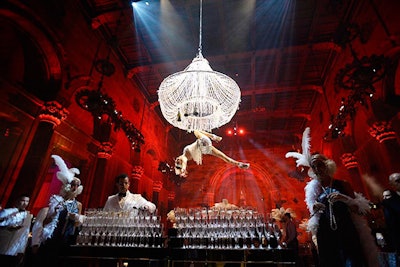 As guests entered a 1920s-inspired premiere, they were captivated as an acrobatic bartender dressed flapper-style topped off champagne flutes while suspended from a 12-foot crystal chandelier.