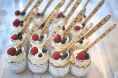 For baby showers, Truffleberry Market in Chicago presents desserts in small vessels that resemble baby food containers. The snacks are served with spoons that read: “Cute as a button.”