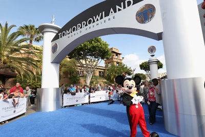 A costumed Mickey Mouse character walked the blue arrivals carpet for Disney's Tomorrowland premiere.