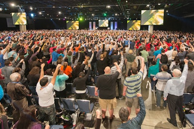 A large group of attendees at the Tony Robbins Unleash the Power Within event in the grand hall of the Broward County Convention Center