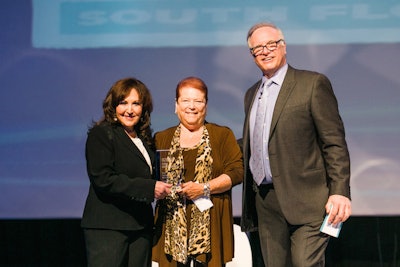 Greater Fort Lauderdale Convention Center chairman and C.E.O., Nikki Grossman (pictured, center), was presented with the Partnership Excellence Award by Ann Keusch and David Adler of BizBash.