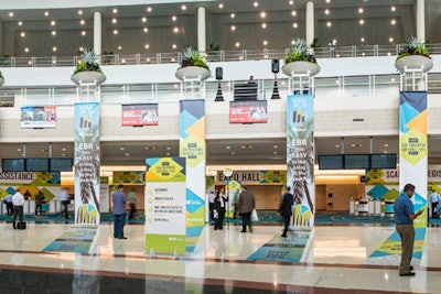 Registration booths set up for the National Retail Federation Loss Prevention Conference & Expo in the lobby of the Broward County Convention Center