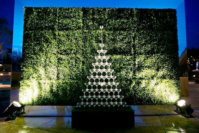 Another sweet sixteen was produced by the JDK Group in April 2014. The company's producer and designer David Everett created a flowing champagne fountain displayed in front of a greenery backdrop with a custom monogram for the party’s step-and-repeat.