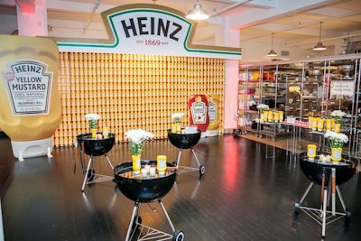 At a media launch for Heinz's new yellow mustard, Peter Callahan Catering's test kitchen was turned into a backyard barbecue. The decor included Weber grills that served as tables.