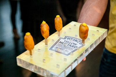 The catering tray for the mustard-topped corn dogs incorporated the label of Heinz's new yellow mustard.
