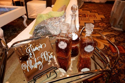Austin, Texas-based Caplan Miller Events set up a personalized whiskey bar cart in honor of the groom at a wedding at the Four Seasons Austin.