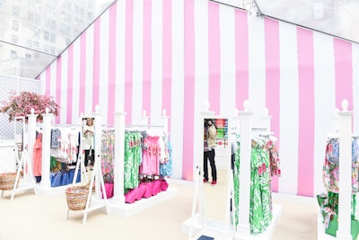 The Lilly Pulitzer for Target pop-up was housed in an existing tent custom-built for Bryant Park Grill and used seasonally by the restaurant. Event producer David Stark added the custom print pink-and-white striped fabric draping for the event.