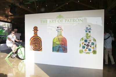 Guests could pedal a stationary bike to cause three large Patrón bottle paintings to move in circles.