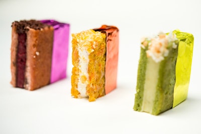 Colorful mini ice cream sandwiches in flavors such as pistachio coconut pineapple and carrot butter pecan caramel served in matching foil, by Abigail Kirsch Catering in New York