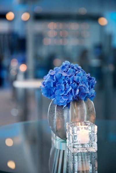 Blue flowers in small silver vases decked tabletops throughout the hotel.
