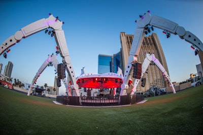 The stage for electronic dance music resembles a spider, with enormous legs jutting out from the central platform.