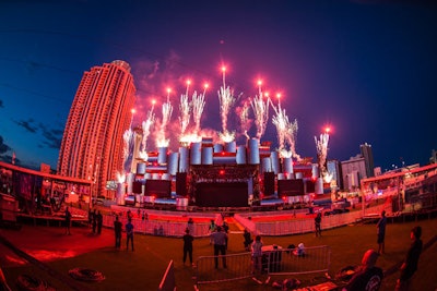 During the festival's first weekend, pyrotechnics exploded from the main stage, a platform that features multiple shiny panels outfitted with lights. The sizable stage measures 262 by 82 feet.