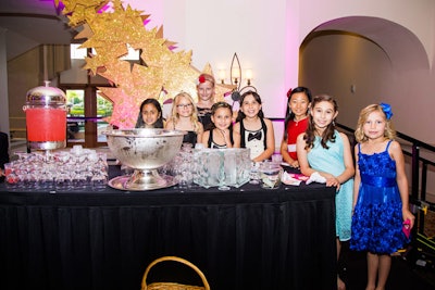 The daughters of Runway to Hope founders Mark and Josie NeJame staffed a pink lemonade stand in the reception area with the help of some of their friends. All of the proceeds benefit Runway to Hope.