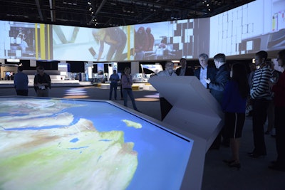 As attendees used touch screens to select data from SAP clients such as John Deere and Lufthansa, it was represented on both the digital world map in front of them and also on the screens that wrapped around the Innovation Showcase.