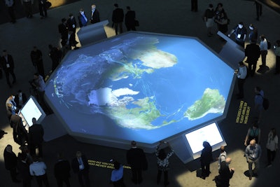 In the center of Sapphire Now's Innovation Showcase, SAP demonstrated its work with airline and shipping companies on a large digital map. Airplanes and ships appeared to travel around the world based on data attendees selected on four adjacent touch screens.