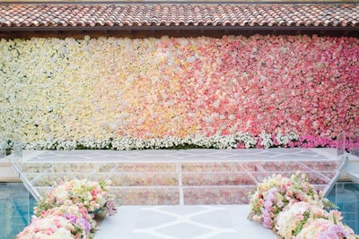 An ombré wall of blooms including cabbage roses and hydrangeas was created by Todd Fiscus for a Fort Worth wedding. In the next few years, designers predict they will see fewer floral centerpieces and more floral environments.
