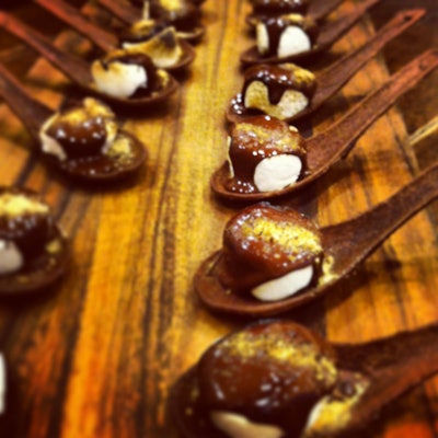 Updated s’mores in chocolate spoons with toasted handmade vanilla bean marshmallows, dark chocolate ganache, and graham cracker dust, by Truffleberry Market in Chicago