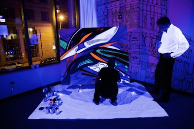 An after-party took place upstairs where entertainment included a speed painter working under a black light that made his work glow.