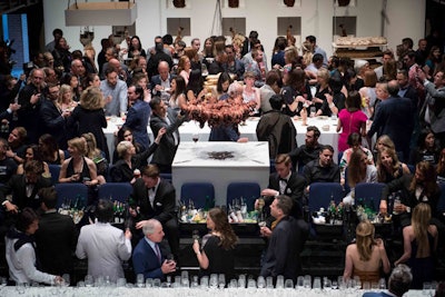 The Power Ball did not have a typical bar setup. Instead, bartenders sat in theater chairs, wearing tuxedos and holding bottles that were ready to be poured. There were also staffers throwing potato chips from the rafters, and guests threw back pieces of bread, cheese, and meat. Partygoers could also snip pieces of octopus from a chandelier hanging overhead.