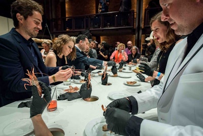 Instead of a traditional plated dinner, V.I.P. guests got an entirely different experience: an interactive experience from food artist Jennifer Rubell. Hands appeared through holes in the table, serving guests one morsel at a time.