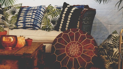 Batika Sofa Palm Pillows Factory Cart Kilim Runner and Moroccan Poufs at Pioneer Works