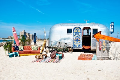 Our Airstream Bar with our Roxy Sofa Peruvian and Moroccan Rugs Surfboards and Pillows