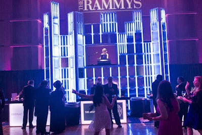 To increase space on the dance floor, event producer Roger Whyte moved the DJ booth to the far edge and elevated DJ Neekola within a geometric light wall.