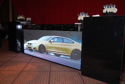 A video screen on the front of the bar in the BMW lounge showed footage of the brand's various cars on a promotional video.