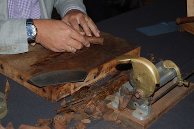 A cigar roller made cigars on-demand for guests.