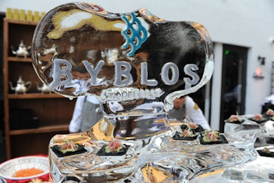 An ice sculpture for the hotel's new Eastern Mediterranean eatery Byblos doubled as a serving piece for tuna tartare atop squid ink crackers.