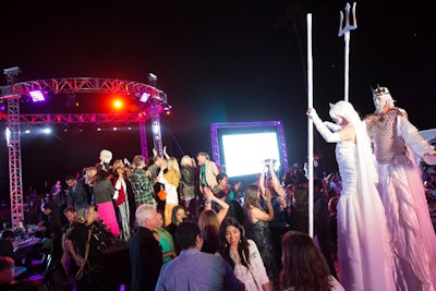 Roving performers in fanciful sea-god costumes interacted with attendees.