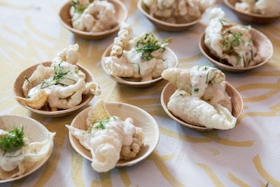 At the event’s welcome reception at the St. Regis Aspen Resort, chef Kristen Kish served salt and vinegar chicharrones with caramelized onion and vegetable dip and whipped crème fraîche.