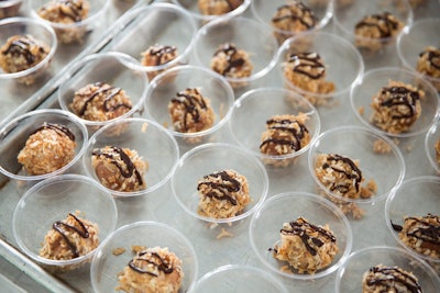 In the Grand Tasting Pavilion, Denver doughnut shop Glazed & Confuzed served its Confuzed Somoa Donuts—caramel-glazed donuts topped with toasted coconut and chocolate drizzle.