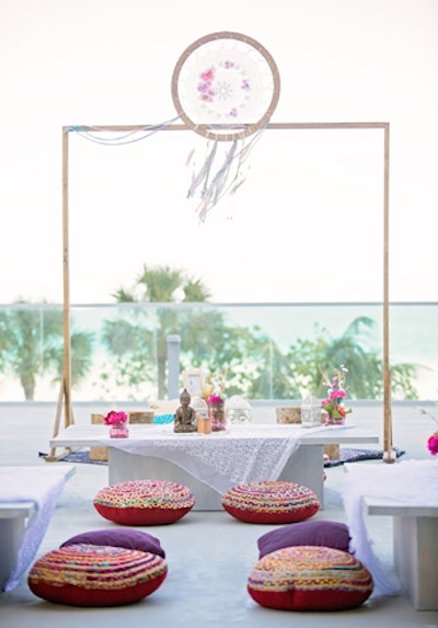 Jewel-hued floor pillows provided extra seating, and oversize dream catchers played into the decor.