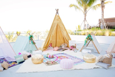 Sparkly teepees were set up on the sand.