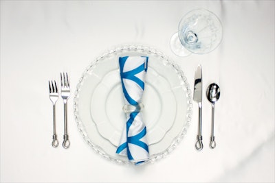 Whisper dinner plate, $2.50, and lunch plate, $1.75; recycled clear napkin ring, $2.85; Cirque Jewel napkin, $2.40, available nationwide with delivery fees from Party Rental Ltd. Bossa Nova glass charger and Corrine wine glass, prices upon request, available in the mid-Atlantic region from All Occasions Party Rental. Knotted flatware, $6.50 for a set of 10 pieces, available throughout the East Coast from New England Country Rentals.