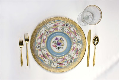 Orizzonte gold charger; Antoinette Bleu dinner and salad plates; Bella gold-banded water glass, prices upon request, available in the mid-Atlantic region from All Occasions Party Rental. Gold flatware, 1.50 per piece, available in the Los Angeles area from the Vintage Table Company.