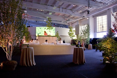 A combination of unpotted birches, redwoods, and other trees dotted the cocktail area, which also featured another picnic scene in the center of the bar. The greenery was donated to community gardens and local parks following the event.