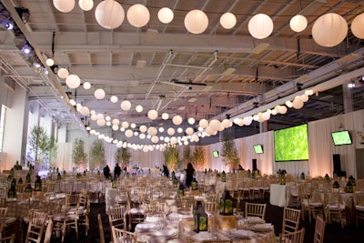 Large white lanterns were strung across the ceiling of Pier 36, also known as Basketball City.