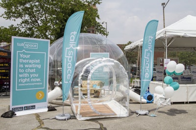 Using Talkspace’s app, attendees were able to text with a licensed therapist within large, immersive therapy meeting bubbles outside the expo.