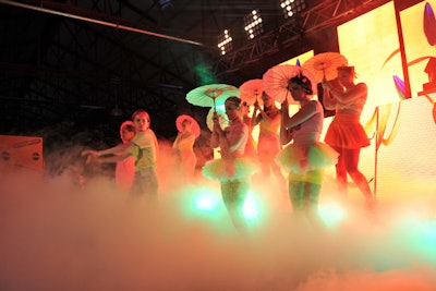 With costumes inspired by Tokyo's famous Harajuku girls, another set of performers twirled parasols in a cloud of illuminated fog.