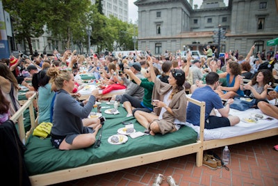 At the World Domination Summit in Portland, Oregon, on July 10, more than 600 people lounged in 160 beds to set a world record for the most people eating breakfast in bed. The meal included breakfast burritos and fruit from Elephants Catering, yogurt parfaits provided by Kind Bars, and doughnuts from Voodoo Doughnuts. Organizers encouraged guests to dress in pajamas, and afterward they donated the beds to local organizations that serve the needy. The record attempt is still being reviewed by Guinness World Records.