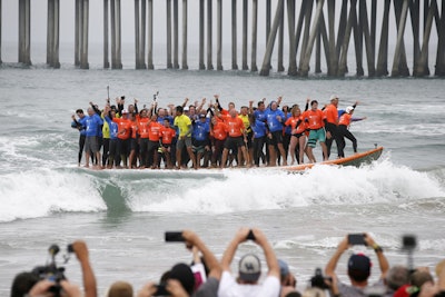 Visit Huntington Beach and the Epic Big Board Ride broke the world record for the most people riding a surfboard after cramming 66 people onto an 11- by 42-foot board as part of the city’s “100 years of surfing” celebration. The event took place on June 20, which was also International Surfing Day. The participants balanced for 13 seconds, three seconds longer than required to break the record. Following the event, Guinness World Records also confirmed the board set a new record for the largest surfboard.