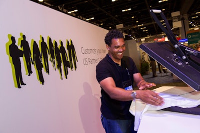 At the T-shirt counter, attendees fill out a form indicating which years they have attended the Worldwide Partner Conference, and then staff print those 'tour dates' on the back of a shirt, similar to a concert tour shirt.