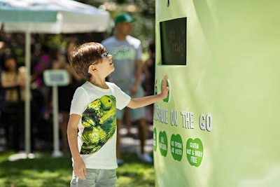Kids were encouraged to push a button in the center of the machine, which activated a launching mechanism that shot out a GoGo Squeez applesauce packet from the top.