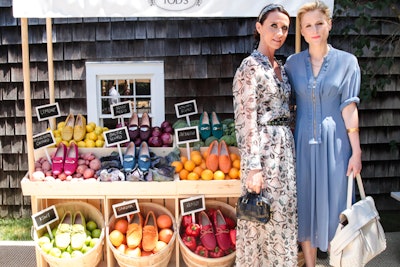 Tod's creative director Alessandra Facchinetti (left, with actress Mamie Gummer) used a custom farm stand to showcase loafers paired with color-coordinated produce baskets at a luncheon in the Hamptons.