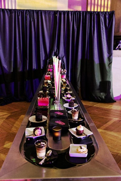 The desserts, provided by Occasions Caterers, were what Moraru calls a 'chocoholic's dream.' Chocolate-flavored cupcakes, layered cake pops, and parfaits were presented on a conveyor belt.